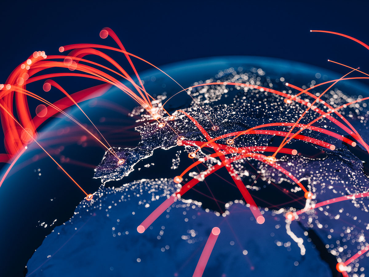 A globe with illuminated cities and red lines representing data connections over Europe and North Africa.
