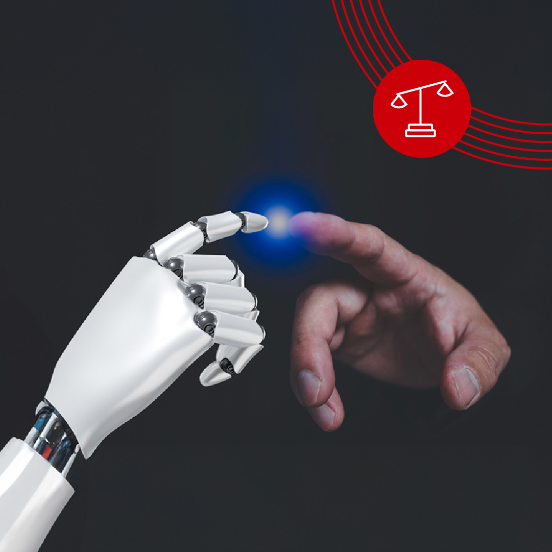 A robot hand and a human hand touch each other with a blue dot of light. Red scales symbol at the top right.